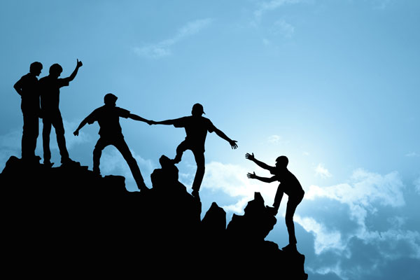 group of people on peak mountain